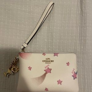 Coach pink stars wristlet with two charms